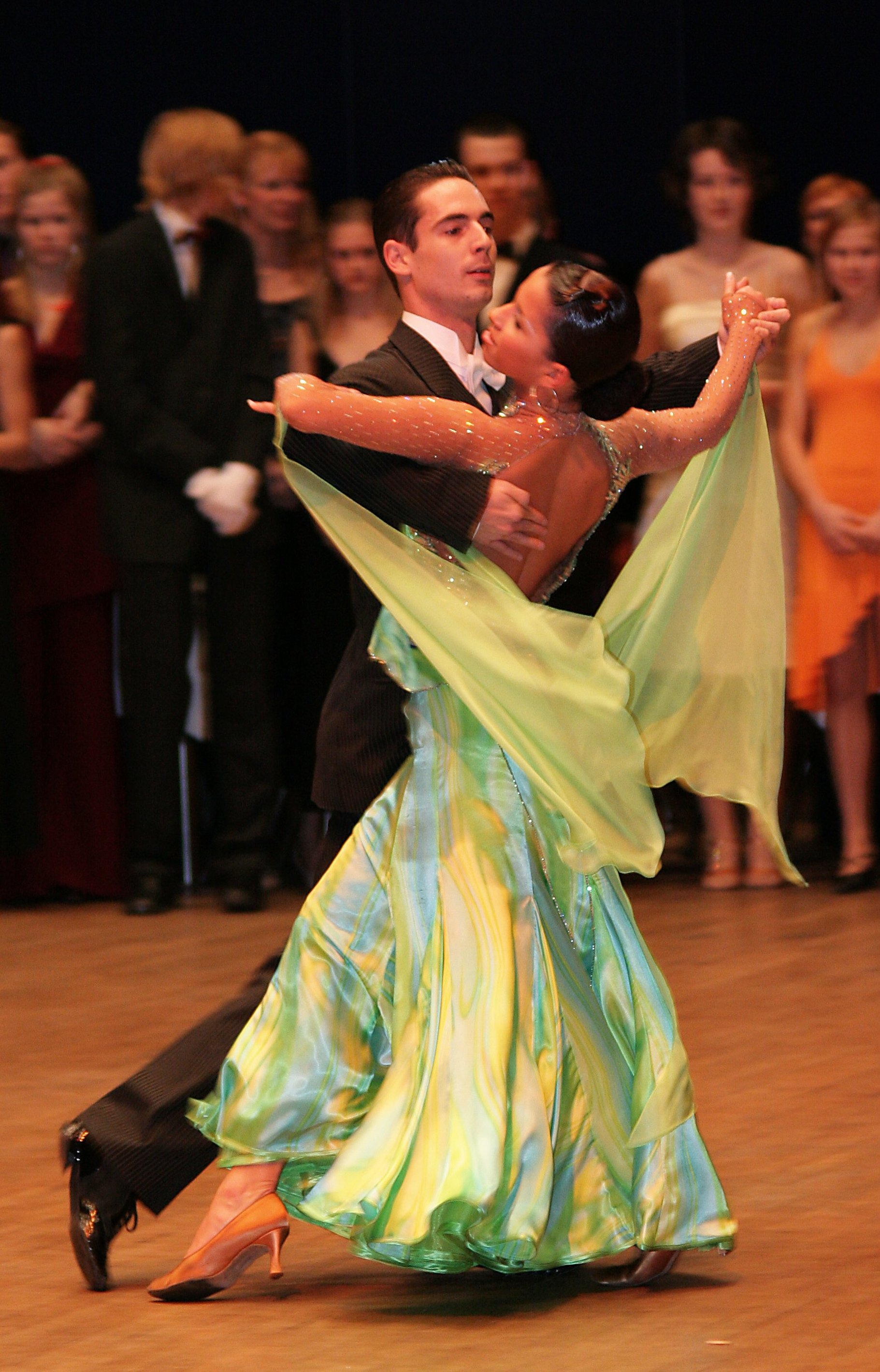 Ballroom competition picture of woman in a green dress