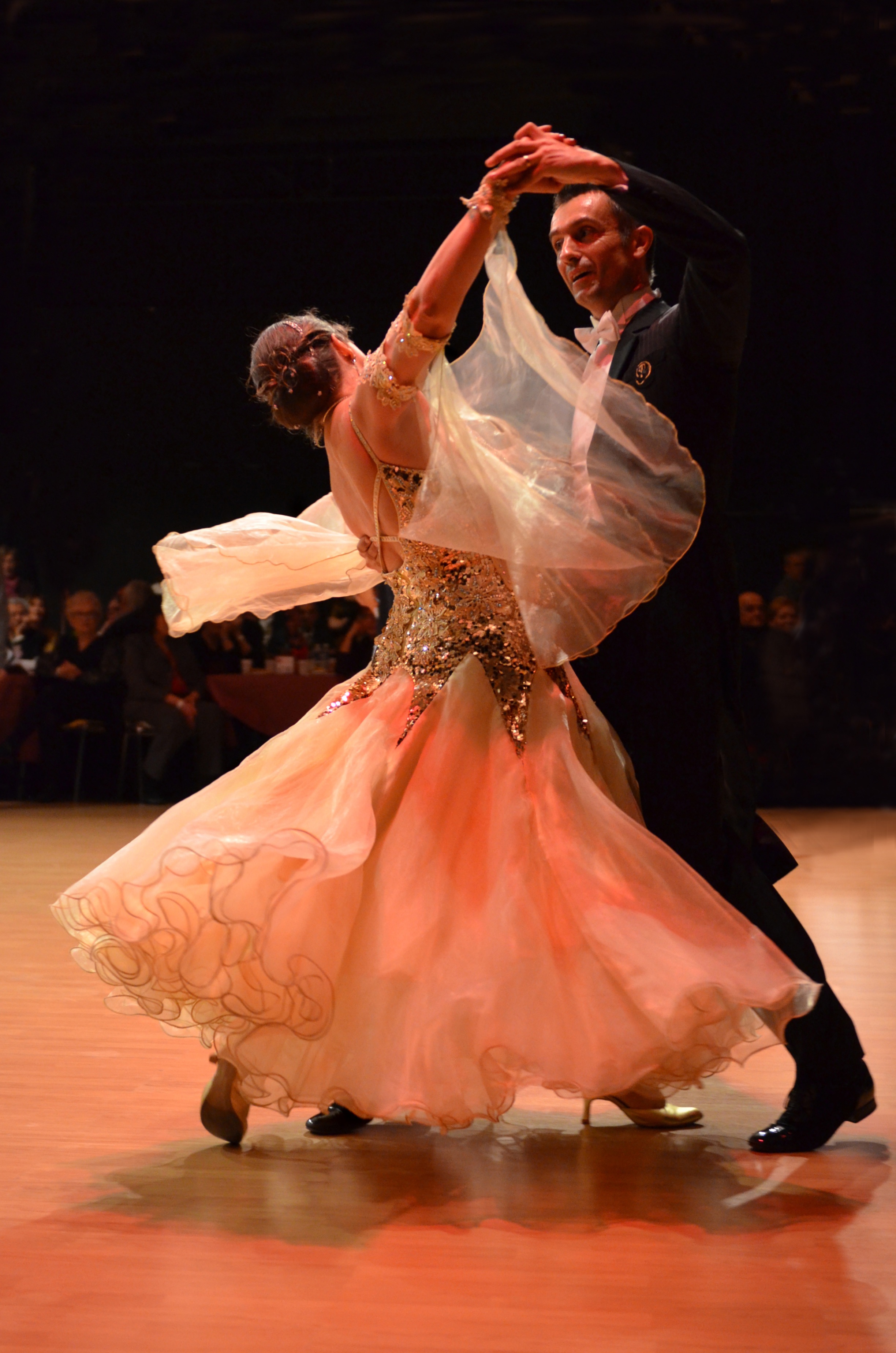 Dance couple mid spin in competition